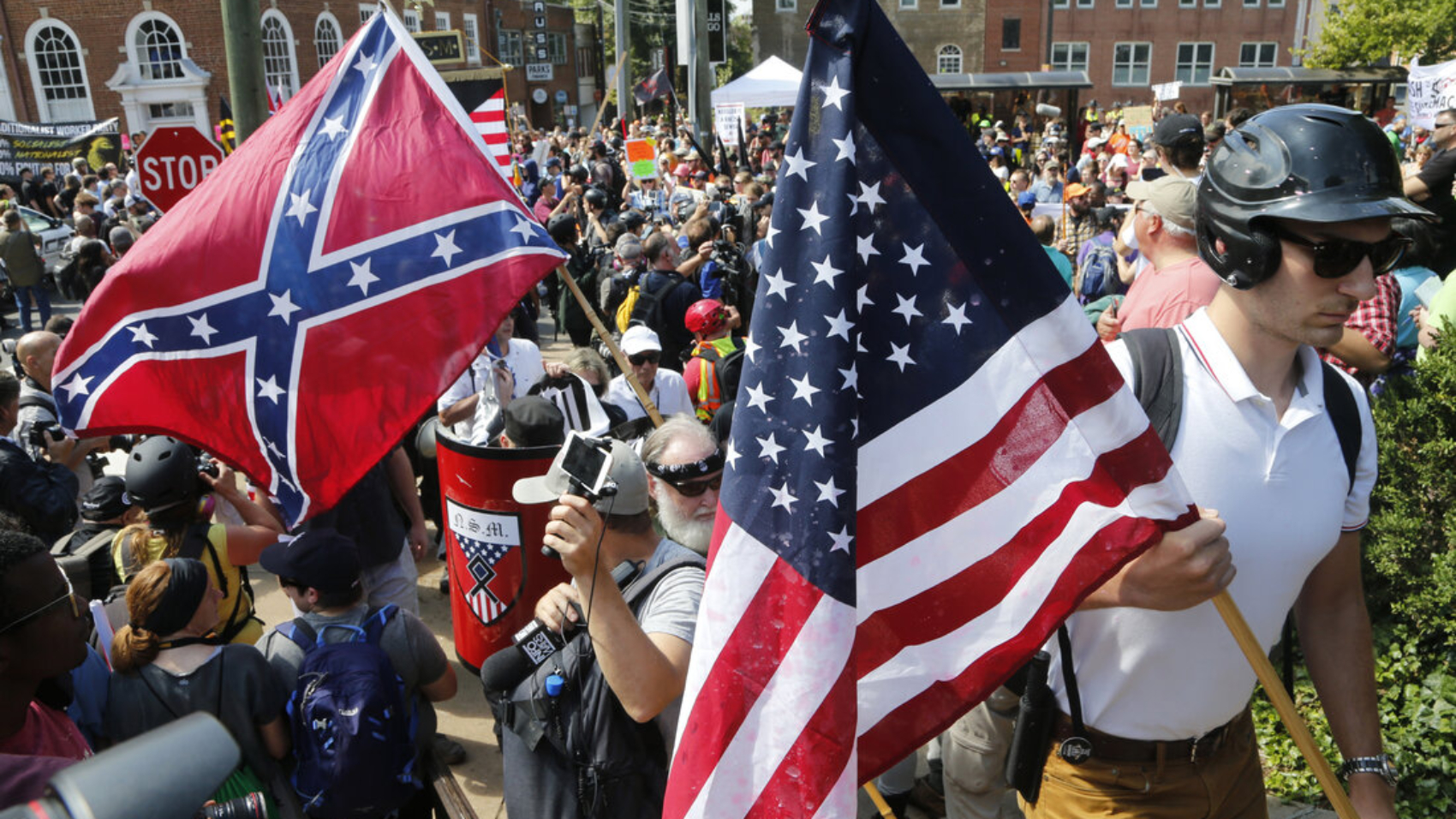 White nationalist demonstrators walk into a park to protest the pending removal of a statue of Confederate Gen. Robert E. Lee in Charlottesville, Va., this weekend.