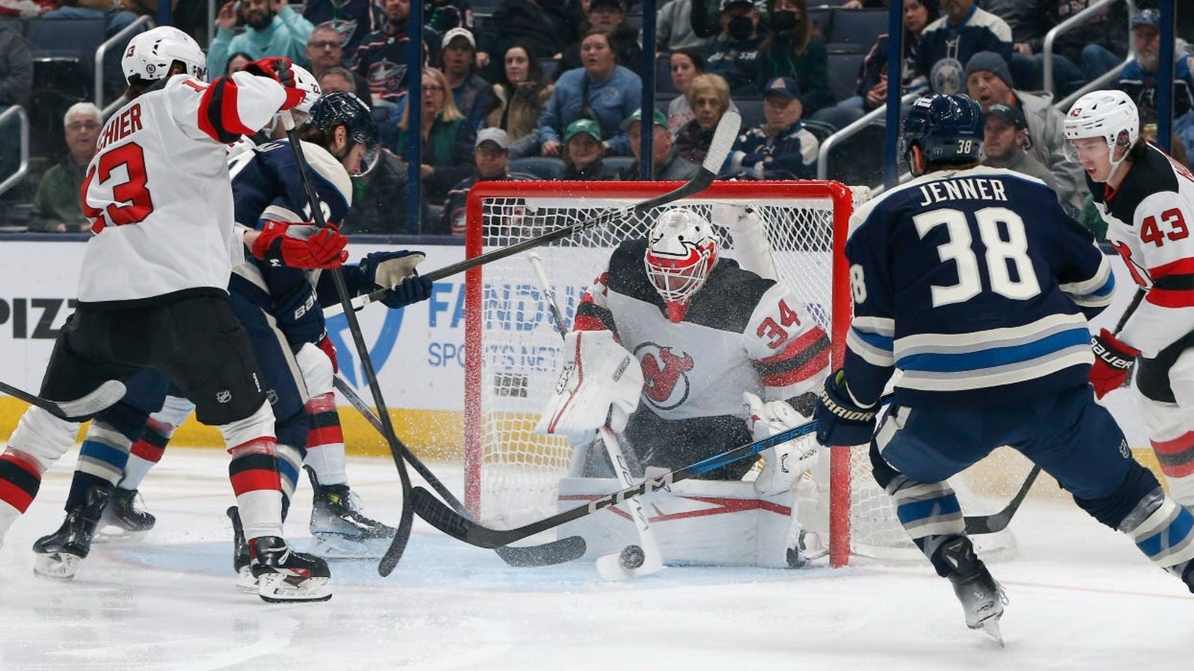 Jake_Allen_making_save_white_Devils_jersey_Blue_Jackets_March_2025